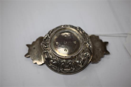 A George IV Scottish embossed silver quaich, 4.25in over handles.